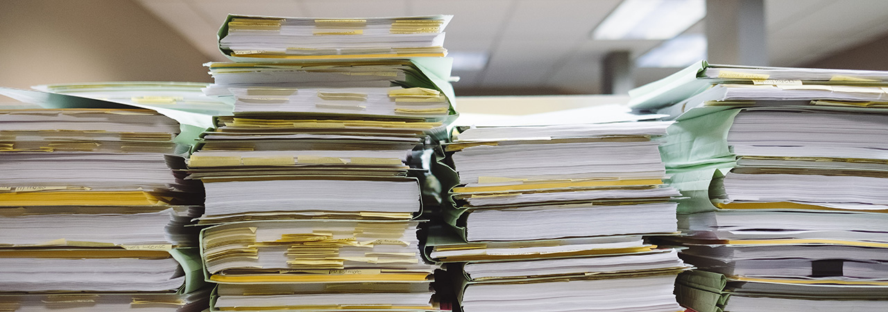 File books stacked on a table