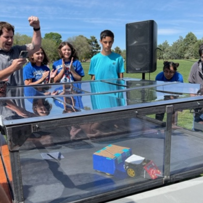 Robot Combat Students cheering for a robot.